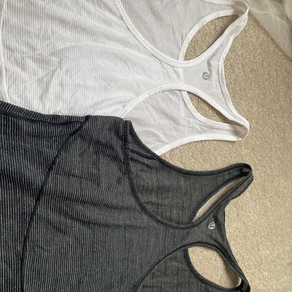 TWO LULULEMON CUTE TANK TOPS IN SIZE 6-BLACK AND WHITE